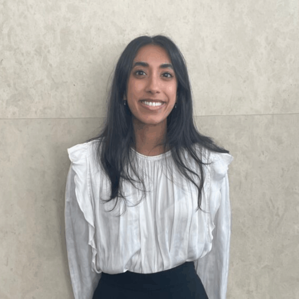 Joycna looking at the camera and smiling.