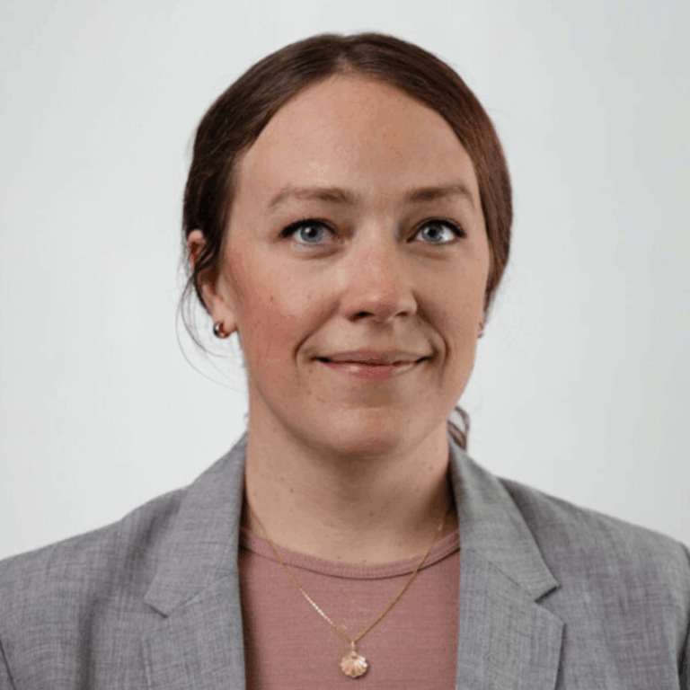 Grace looking at the camera and smiling.